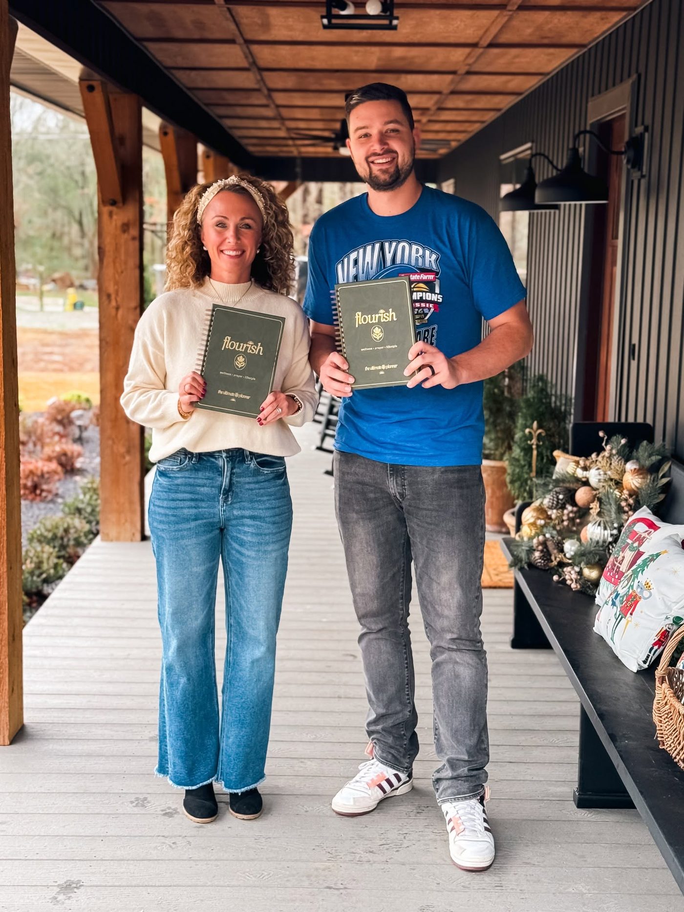 Michelle Johnson and Colin Edwards holding copies of the Flourish planner